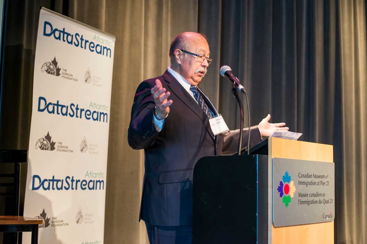 A man speaking at the podium