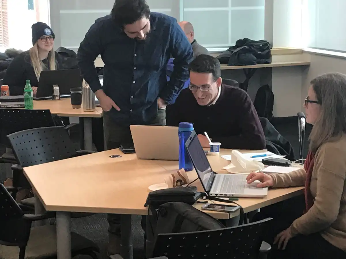 Patrick LeClair reviewing data with Cameron Deacoff at a laptop on a table
---